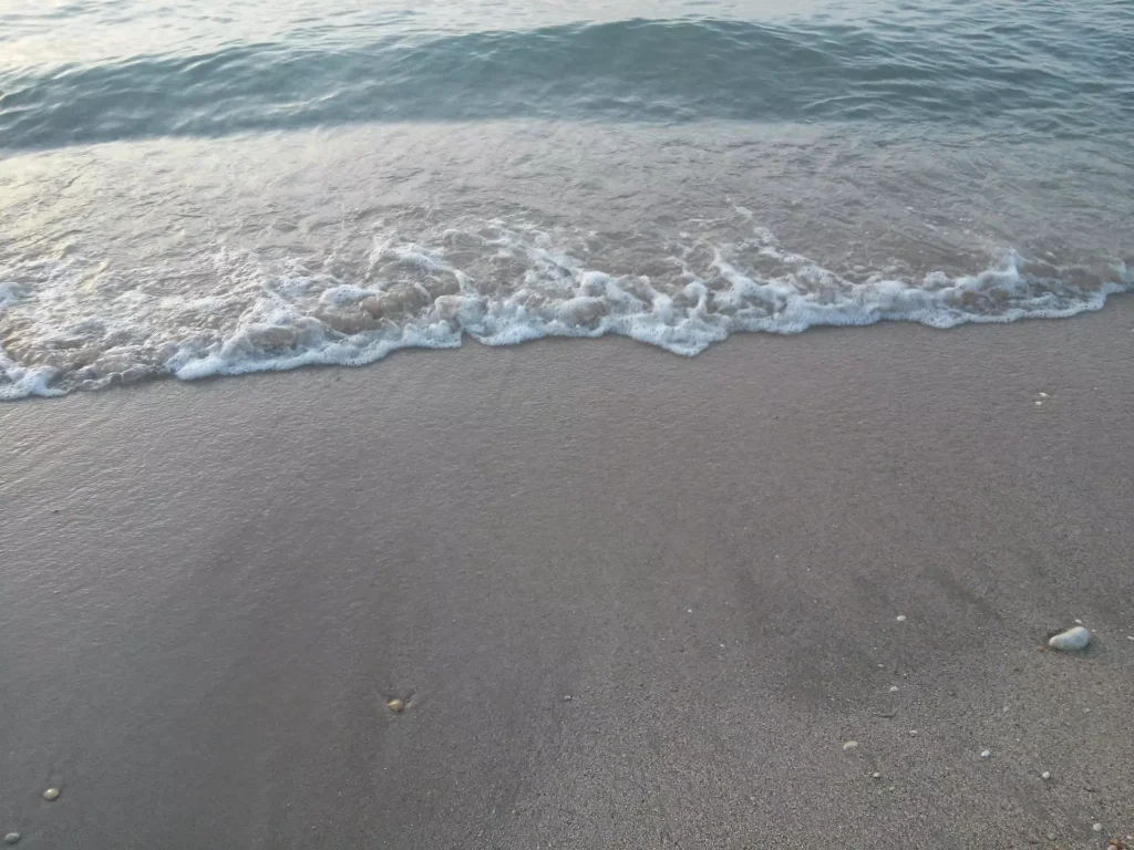 Corfu Acharavi beach waves on the shore 1920w 1024x768