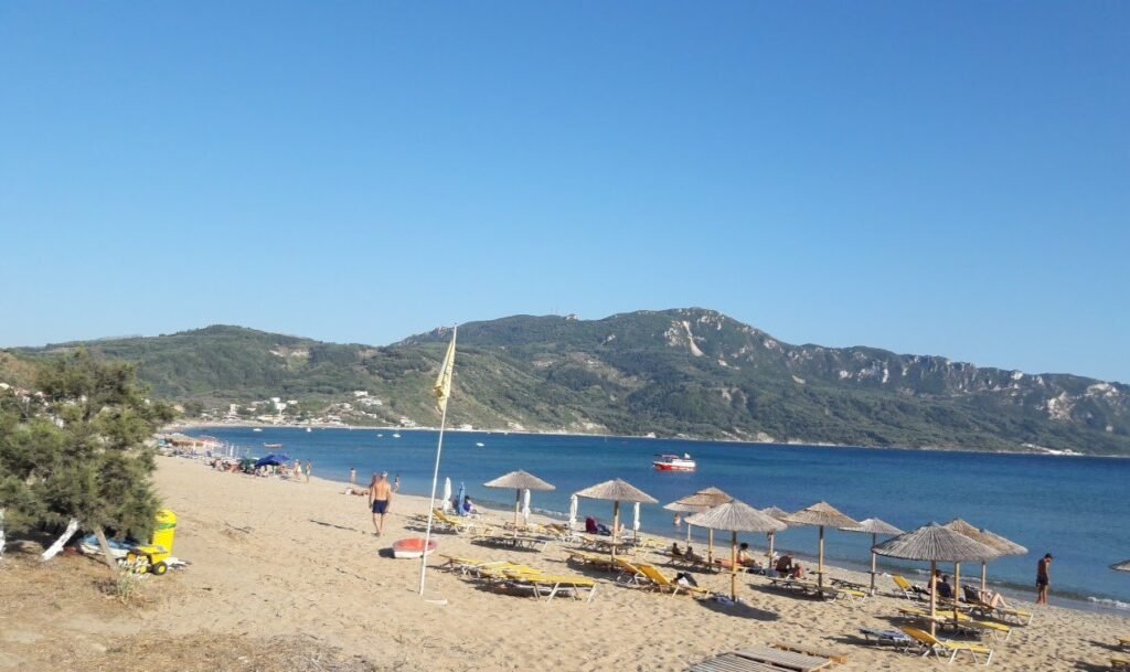 Corfu Afionas beach wicker umbrellas 1920w 1024x609