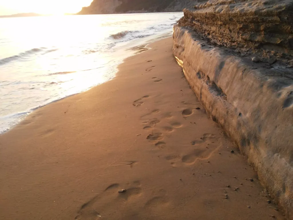 corfu arillas beach footprints in the sand 1920w 1024x768