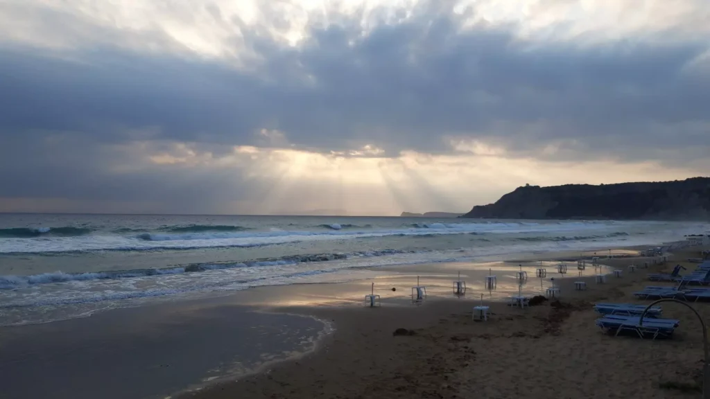 corfu arillas beach waves clouds and sun rays 11 1920w 1024x576