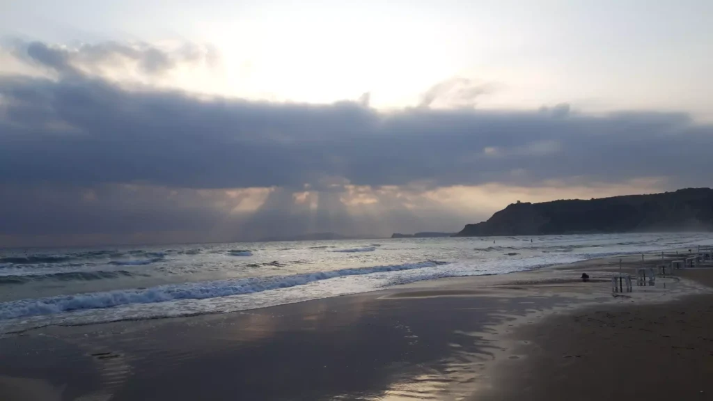 corfu arillas beach waves clouds and sun rays 6 1920w 1024x576