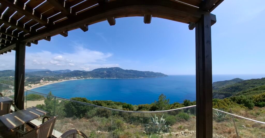 View of Saint George beach from a cafe at Afionas village, Corfu