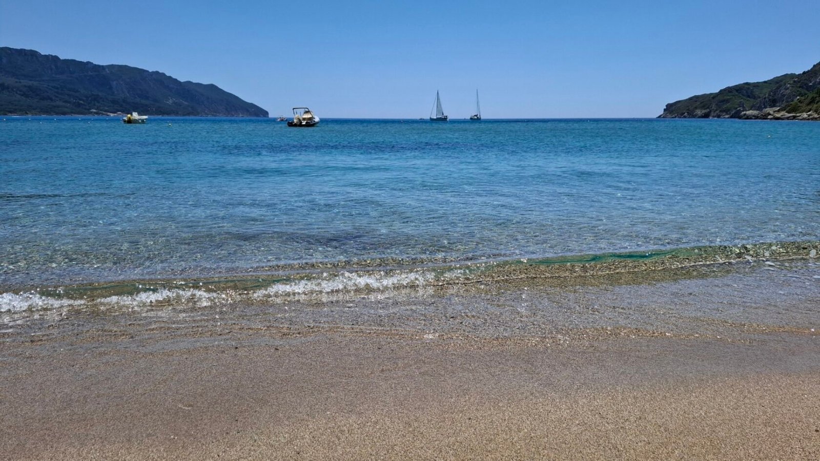 The clear blue waters of Agios Georgios Beach